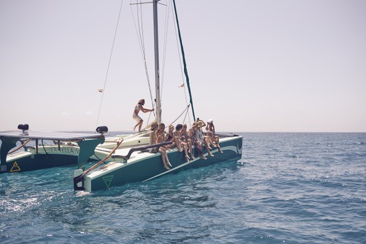 Big charter groups trip on Ecological Catamarans in Formentera, Ibiza